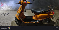 Orange Vespa SXL 150