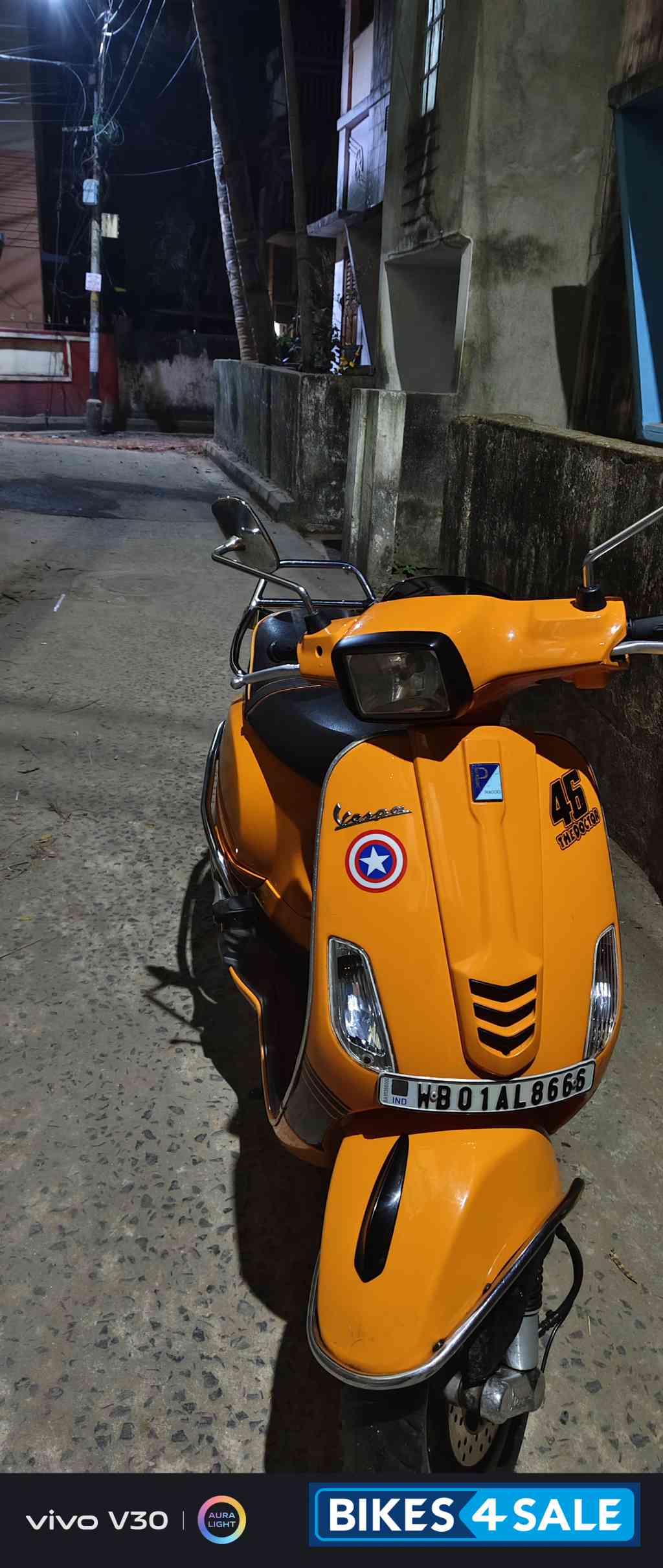 Orange Vespa SXL 150