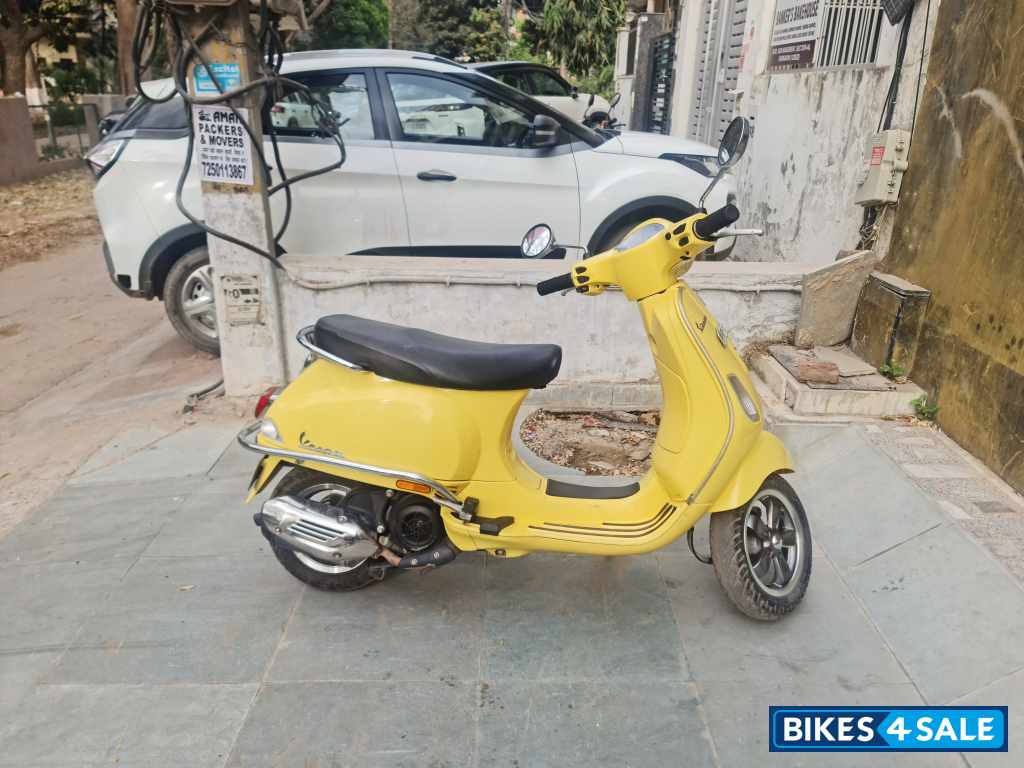 Yellow Vespa VXL 125