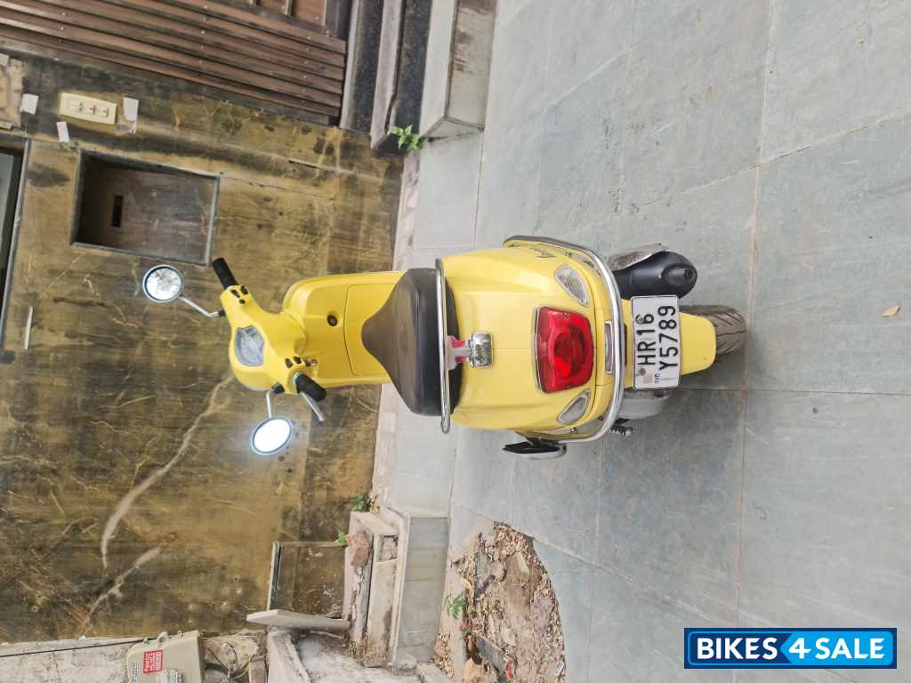 Yellow Vespa VXL 125