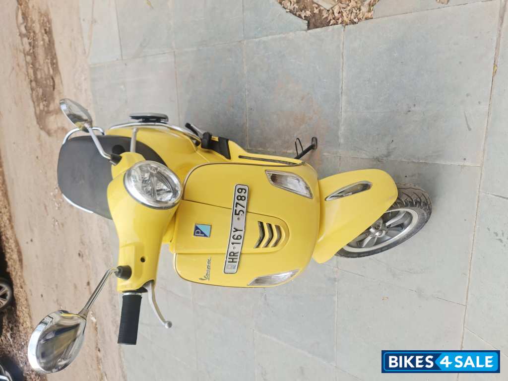 Yellow Vespa VXL 125