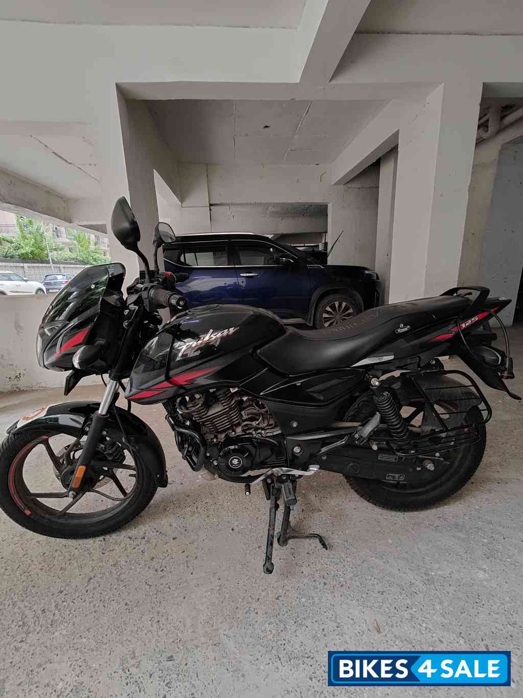 Ebony Black Solar Red Bajaj Pulsar 125 Neon Disc Single Seat