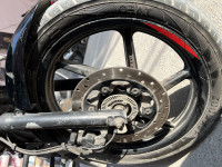 Black-red Bajaj Pulsar 150 Neon