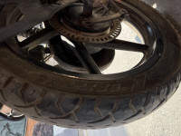 Black-red Bajaj Pulsar 150 Neon