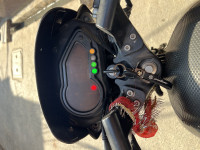 Black-red Bajaj Pulsar 150 Neon