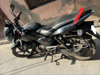 Black-red Bajaj Pulsar 150 Neon