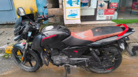 Red/black Bajaj Pulsar 150 Neon