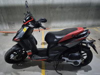 Black Aprilia SR 150