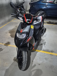 Black Aprilia SR 150