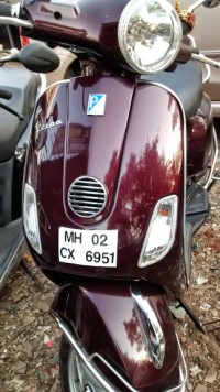 Maroon Vespa LX 125