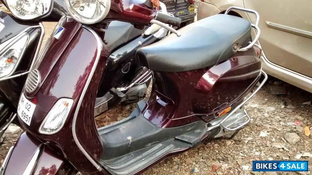 Maroon Vespa LX 125