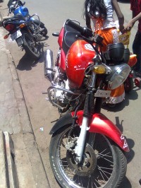 Red Bajaj Pulsar 150 Round Headlight