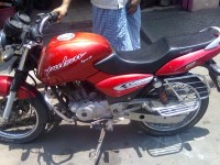 Red Bajaj Pulsar 150 Round Headlight