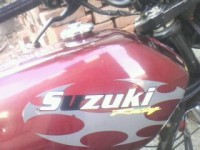 Maroon Suzuki MAX 100R